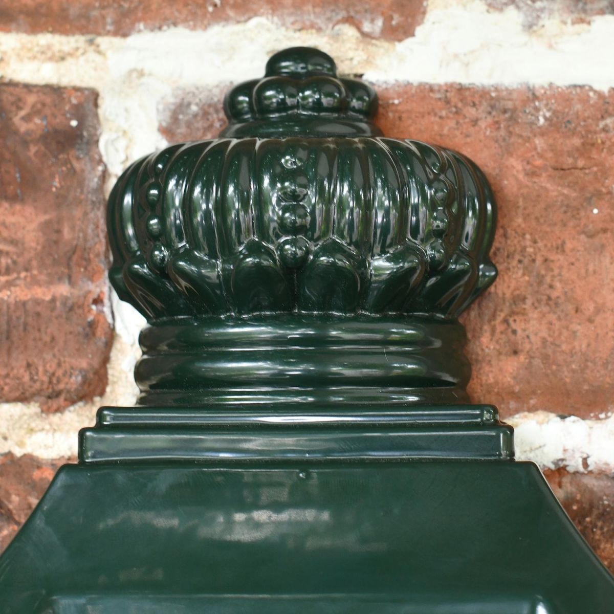 Traditional Finial on the Top of the Green "Odell" Wall Mounted Post Box