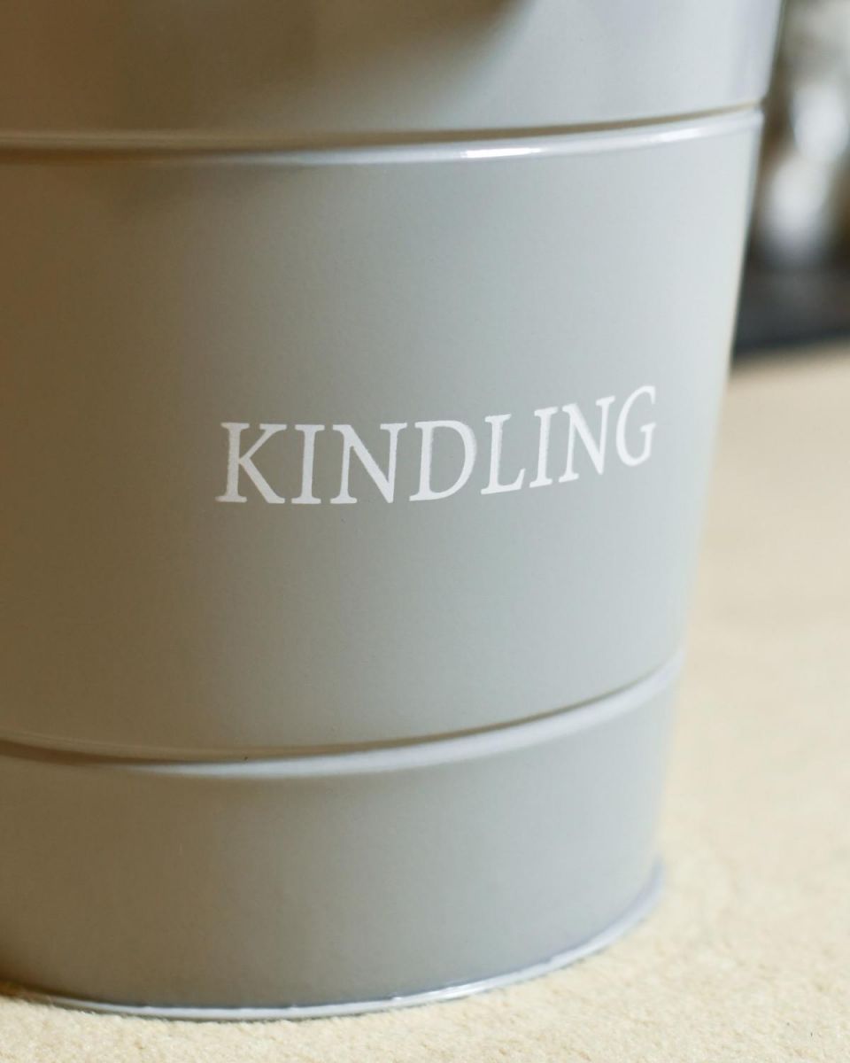Close Up Of Grey "Kindling" Log Store Bucket Lettering