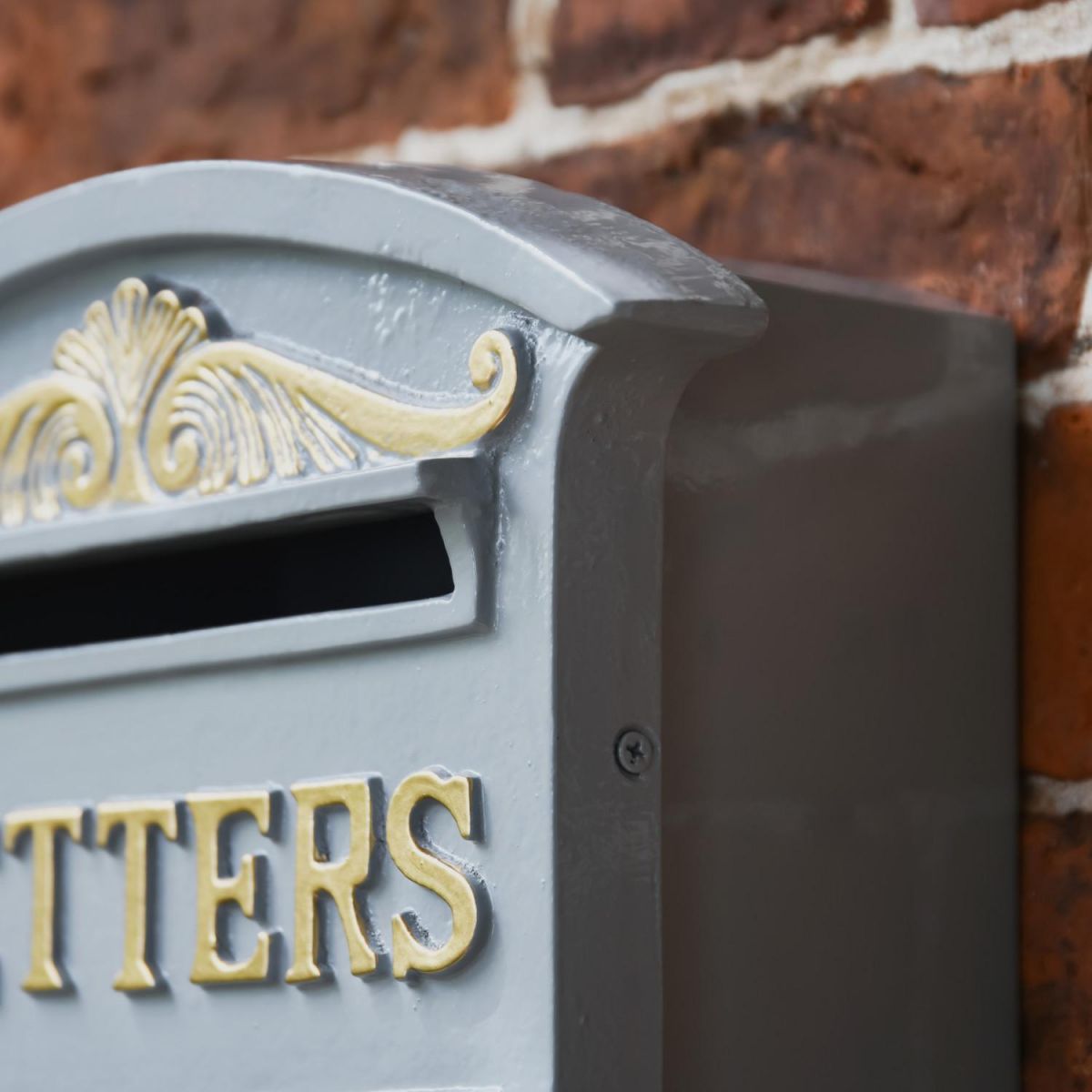 Close-Up of Detail onGrey & Gold Curved Cambridge Traditional Wall Mounted Post Box