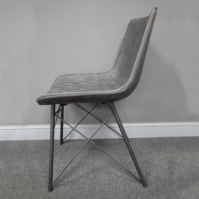 View of the Side of the Grey Leather Dining Chair