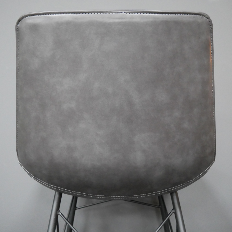 Close-up of the Back of the Grey Leather Dining Chair