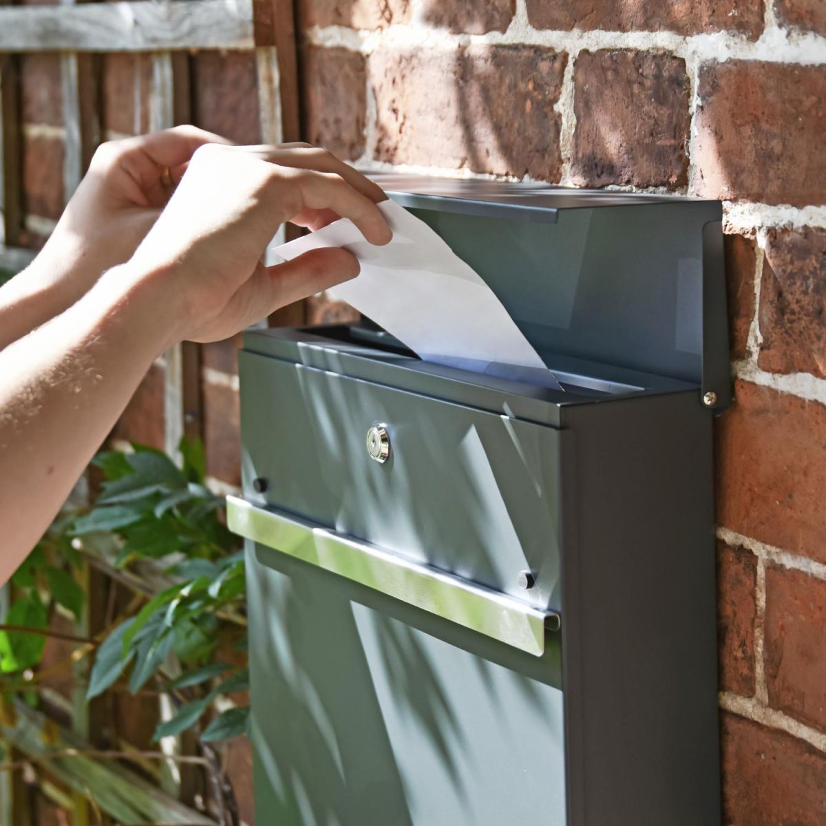 Letter Flap in Use on Grey & Silver "Harmonious" Wall Mounted Post Box & Newspaper Holder