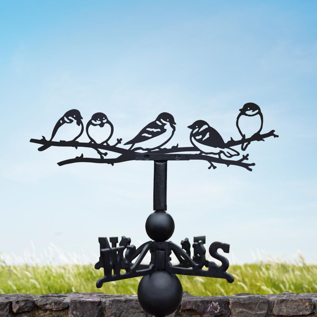 Group of sparrows weathervane on a sunny day