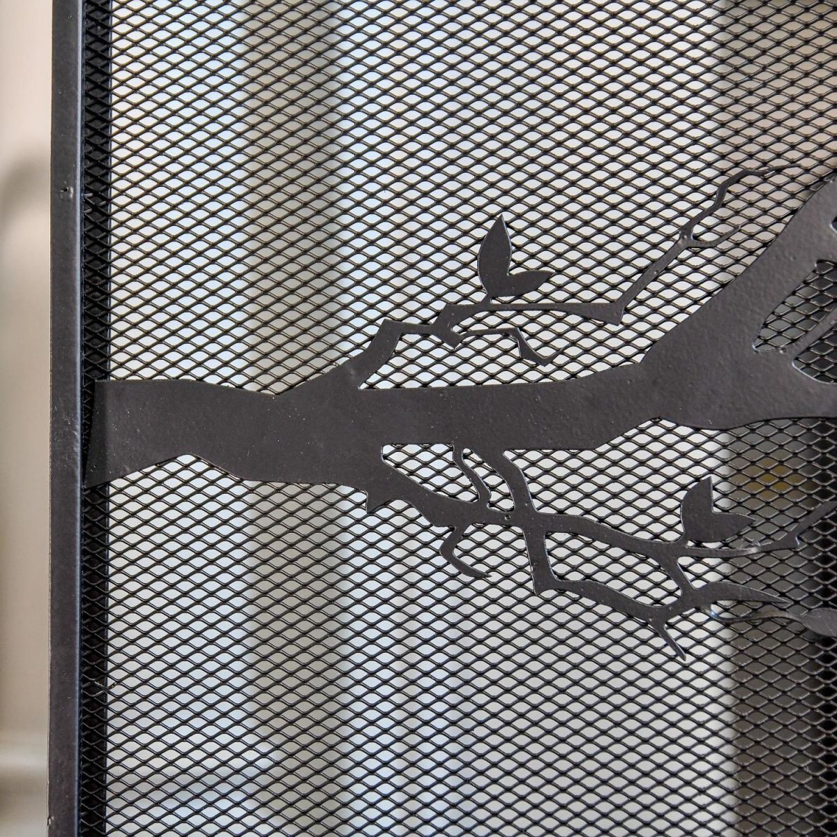 Close up of mesh netting and branch detailing Close up of mesh netting and branch detailing