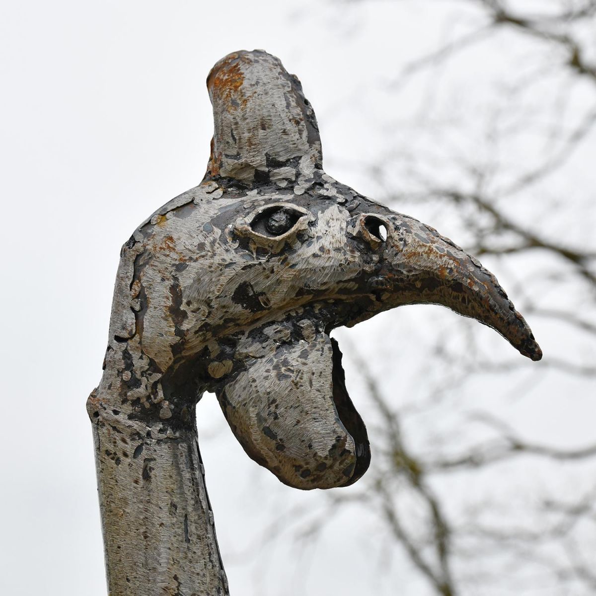 Close-up of the Head of the Guinea Fowl Recycled Metal Garden Sculpture Close-up of the Head of the Guinea Fowl Recycled Metal Garden Sculpture