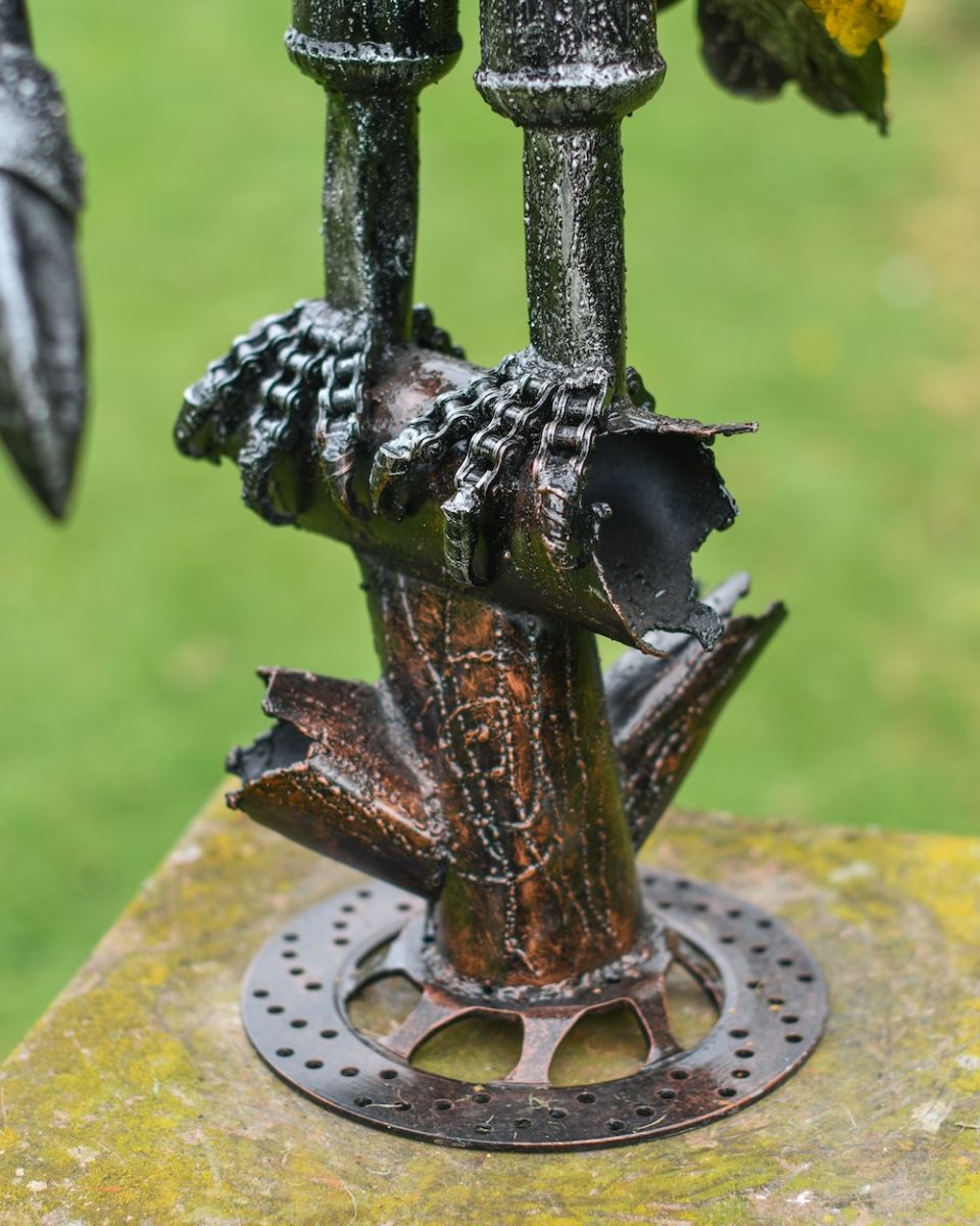 Close up of feet detail on scrap metal art sculpture Close up of feet detail on scrap metal art sculpture