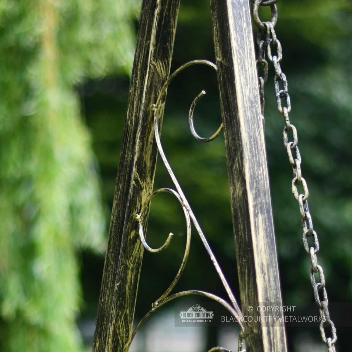 Hand forged curls on exterior swing seat