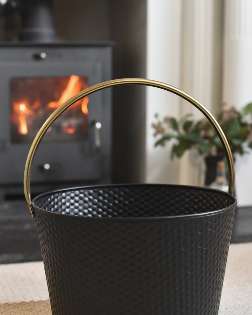 Close Up Of The Black And Gold Finish On The Traditional Log Bucket