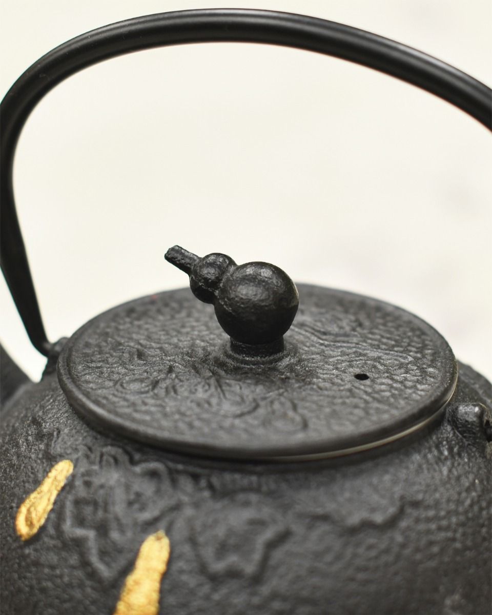 Handle Up On Black Teapot 