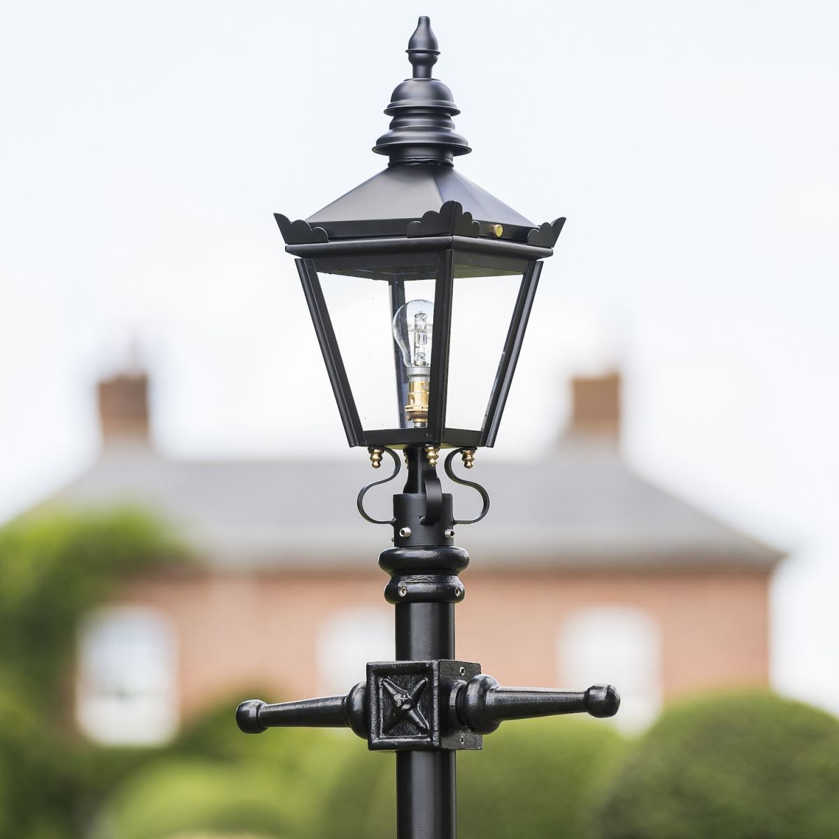 Close up of lantern on black garden lamp post