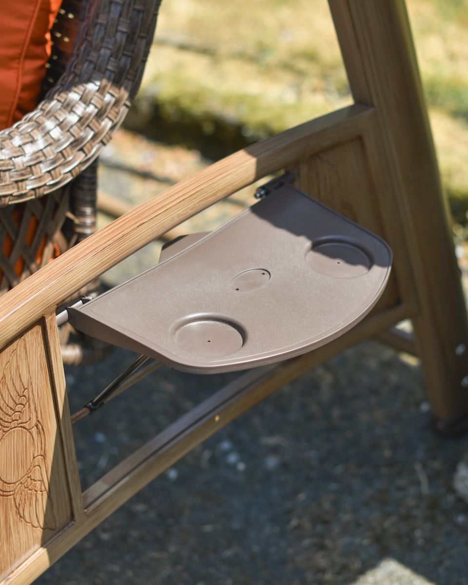 Close up of cup holder detail on garden swing seat Close up of cup holder detail on garden swing seat