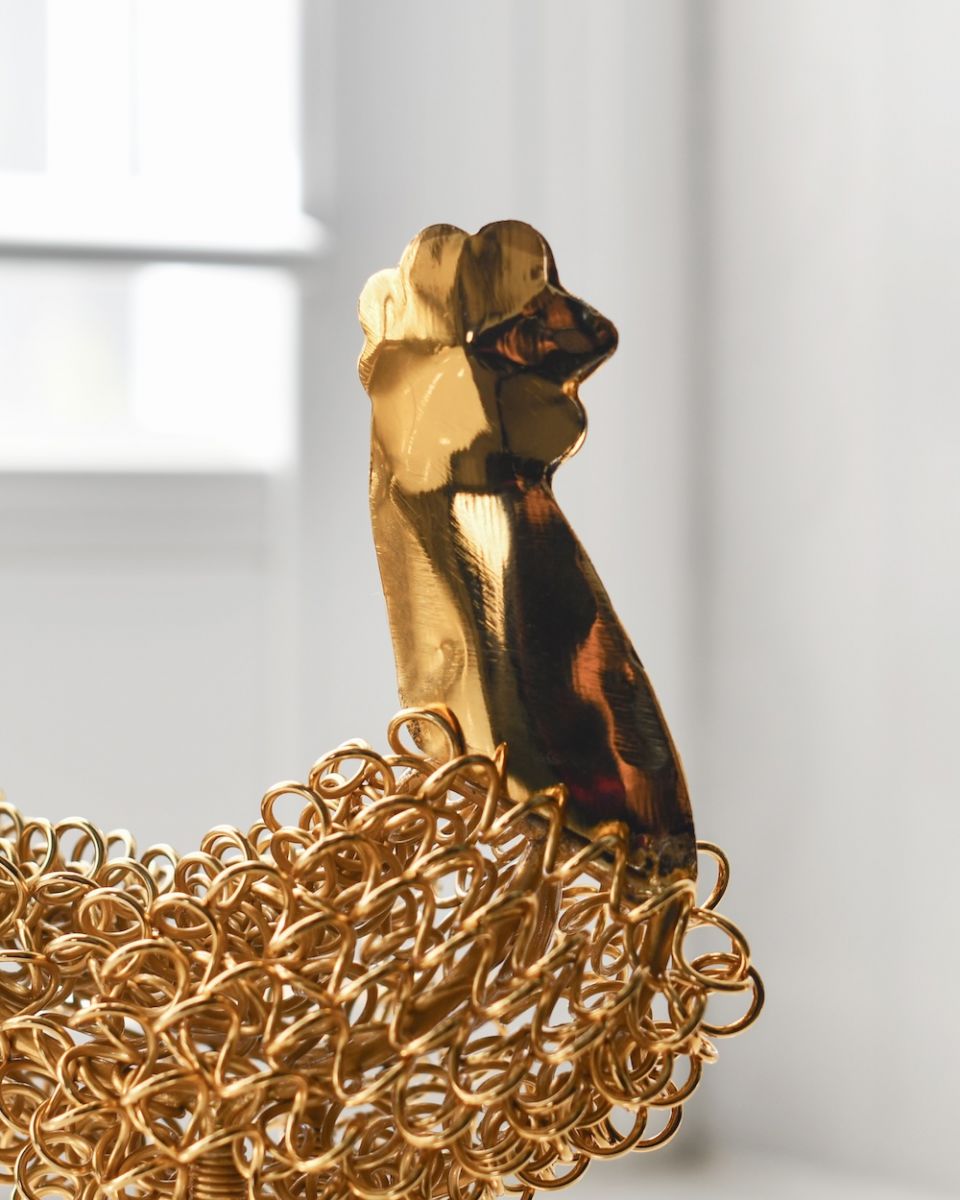 Close up of head detail on cockerel sculpture