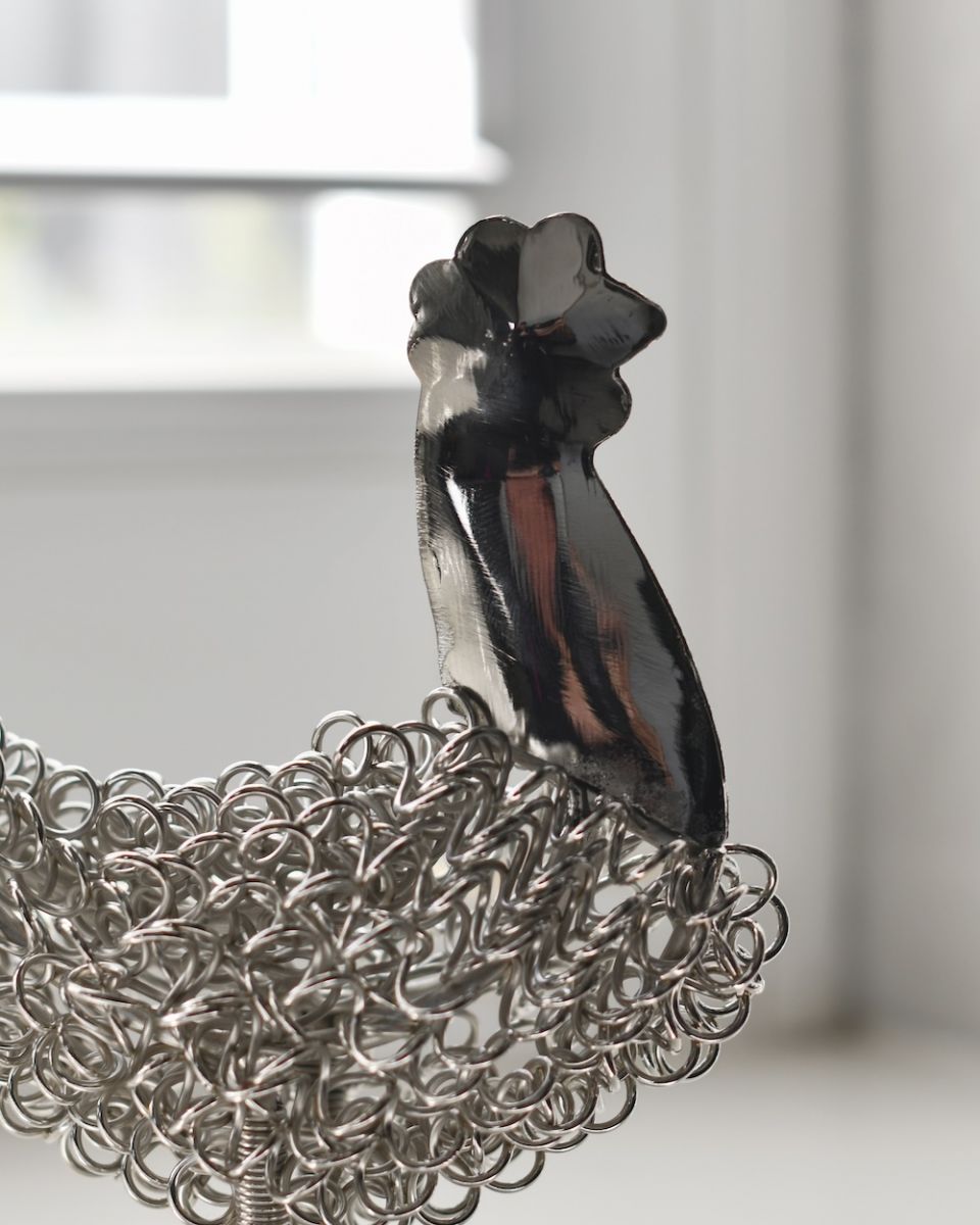 Close up of head of recycled cockerel sculpture