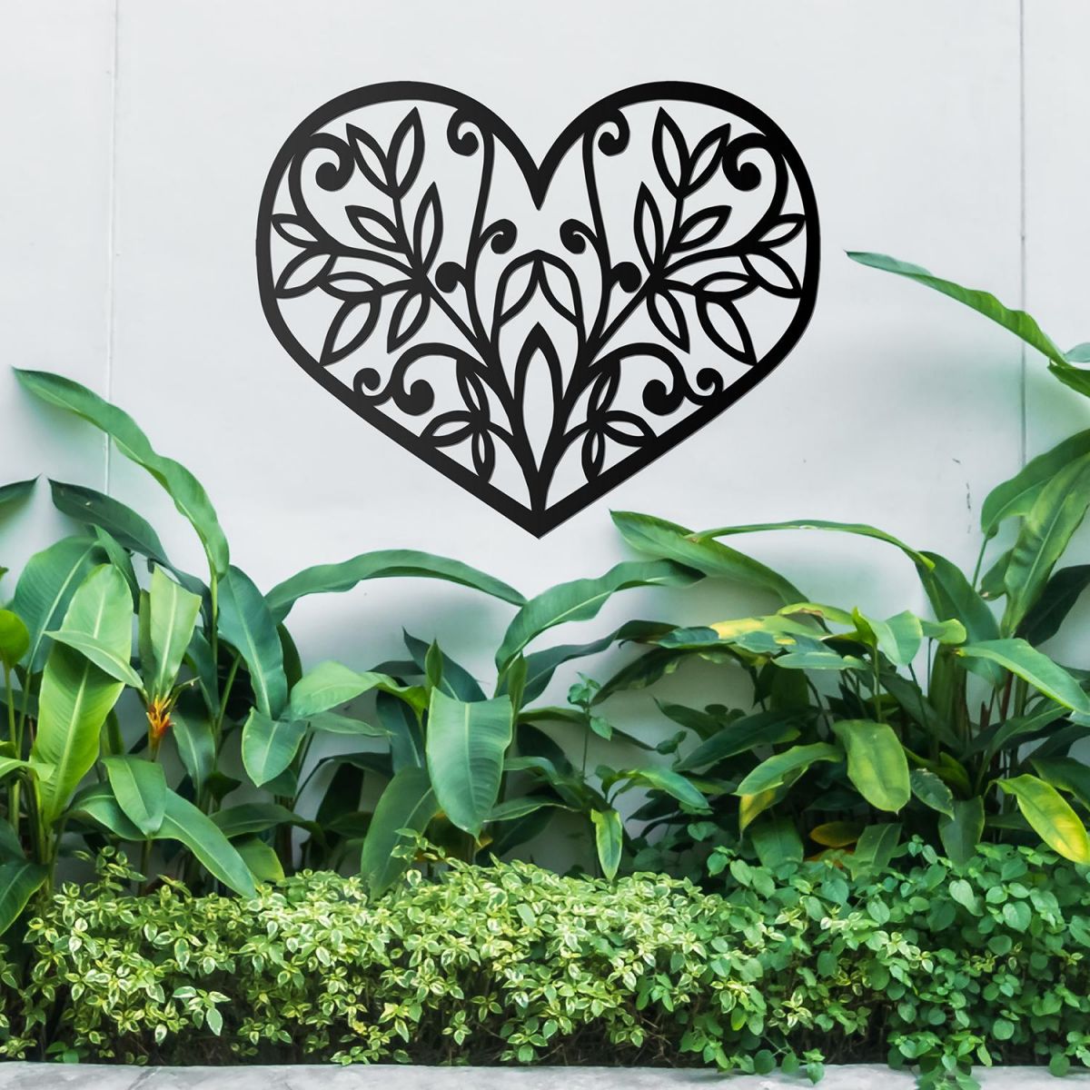 Flower Foliage Heart Wall Art above a Bush in the Garden