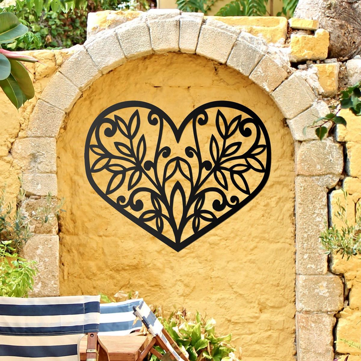 Flower Foliage Heart Wall Art in Situ in on a Yellow Garden Wall