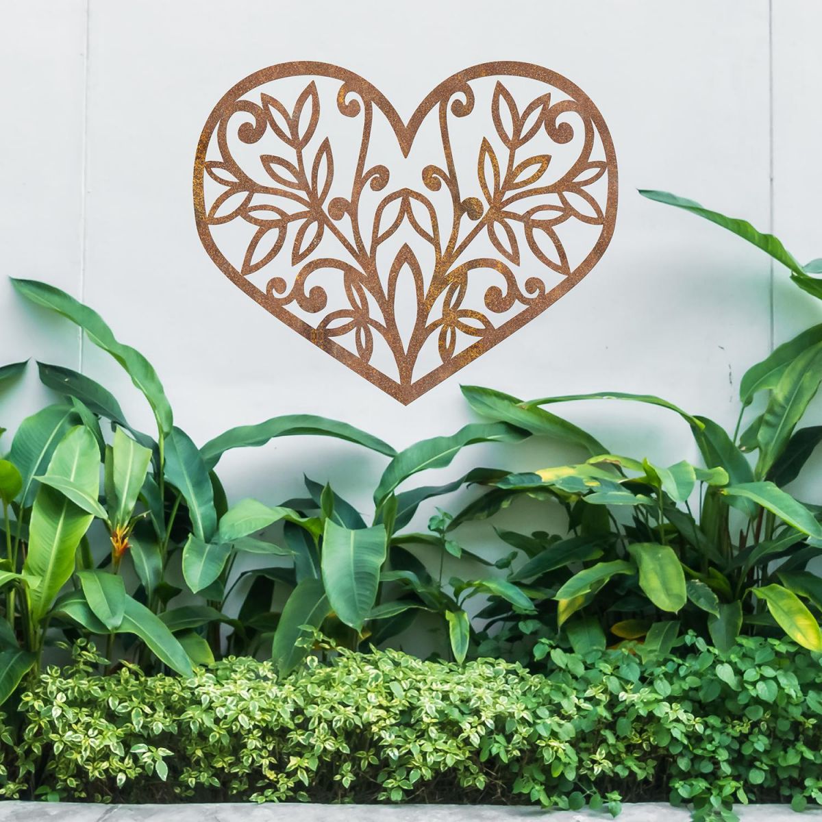 Flower Foliage Heart Wall Art above a Bush in the Garden