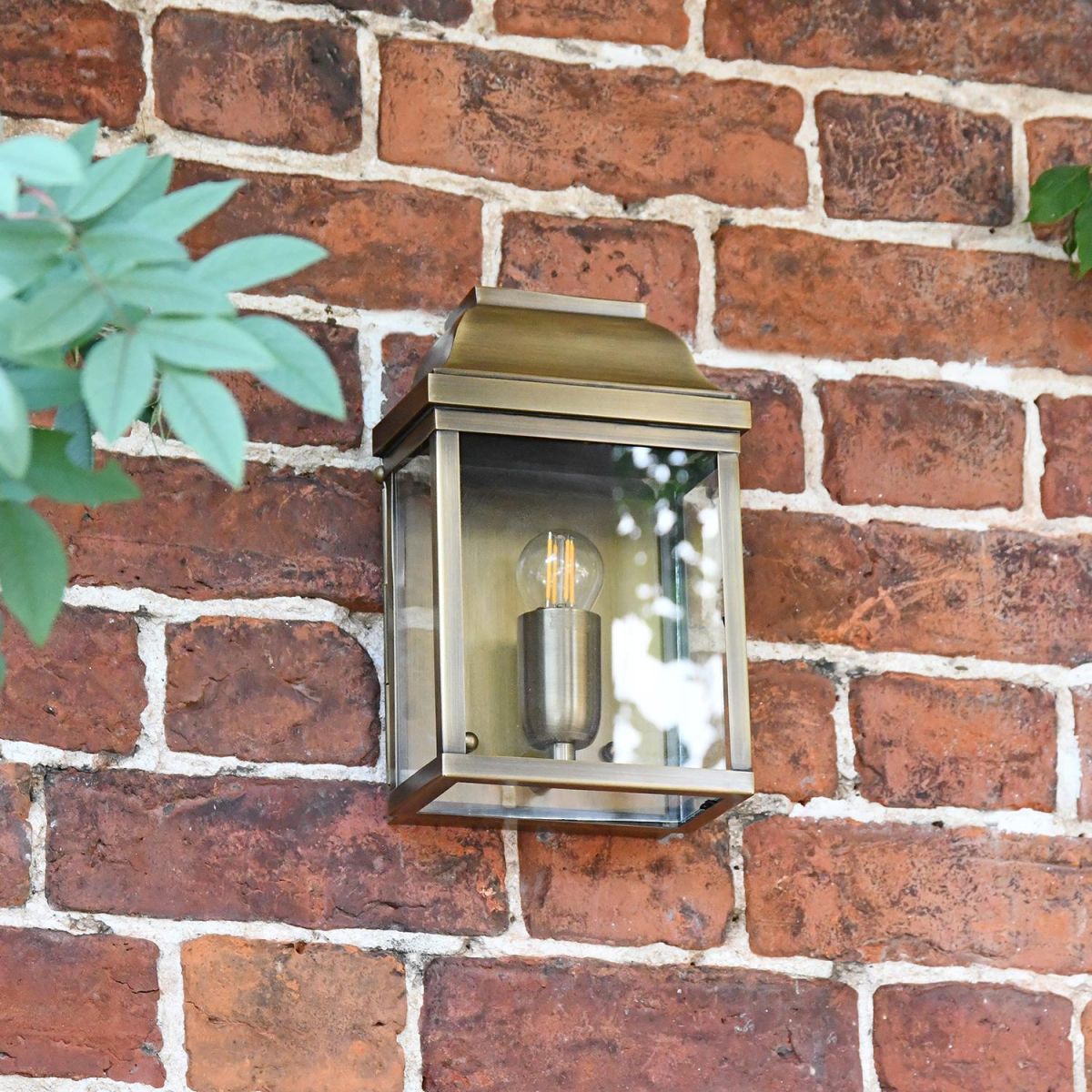  Half Wall Lantern Finished in an Antique Brass