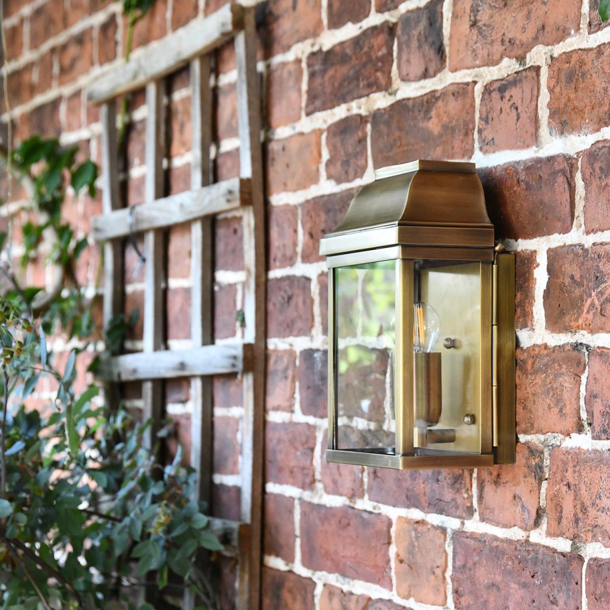 "Heathfield" Antique Brass Half Wall Lantern on the Front of a House