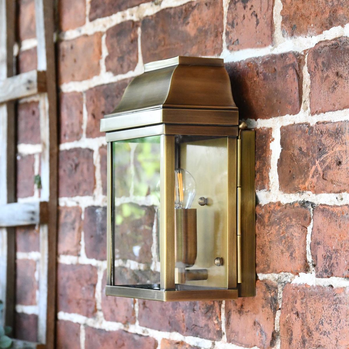 "Heathfield" Antique Brass Half Wall Lantern in Situ on a Brick Wall 