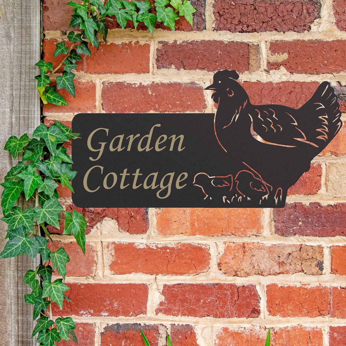 Hen & Chicks Iron House Name Sign in Use on a Brick Wall