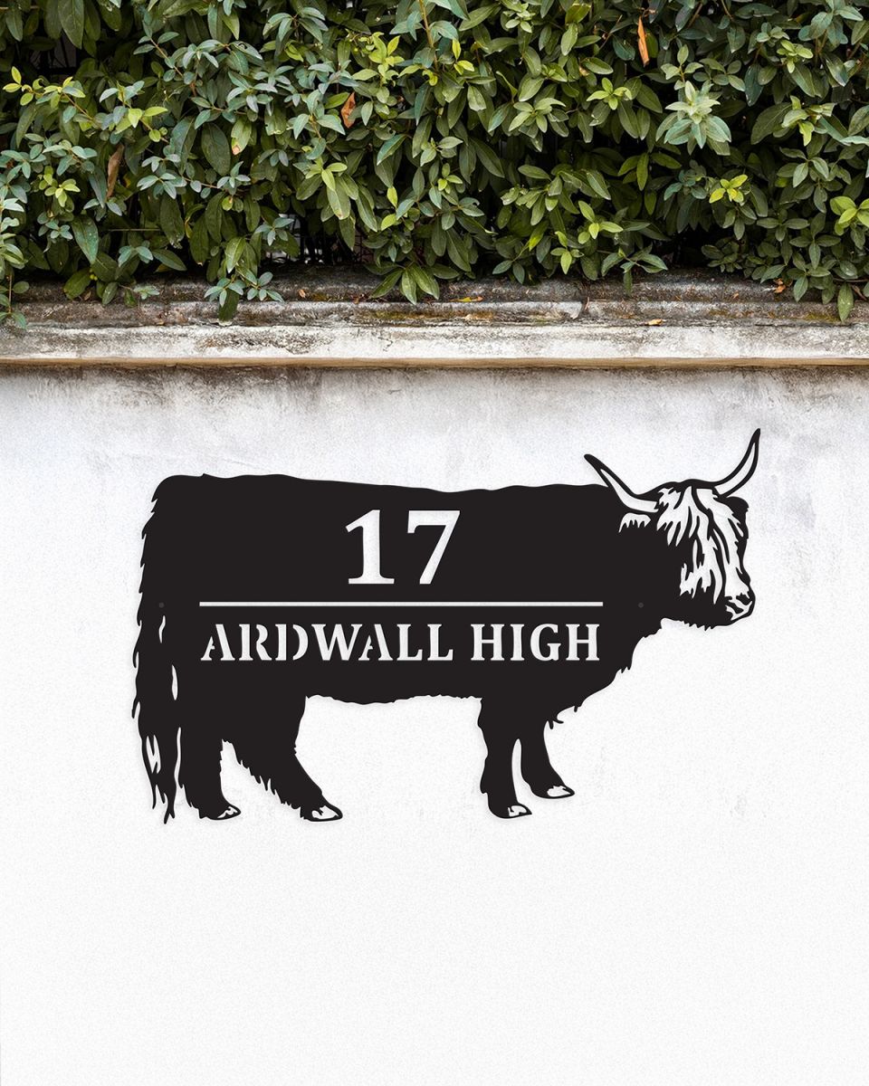 Highland Cow Steel House Sign on a White Garden Wall