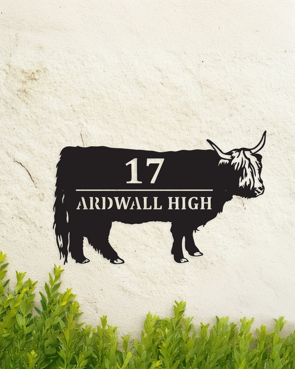 Highland Cow Steel House Sign in Situ on a Painted house Wall
