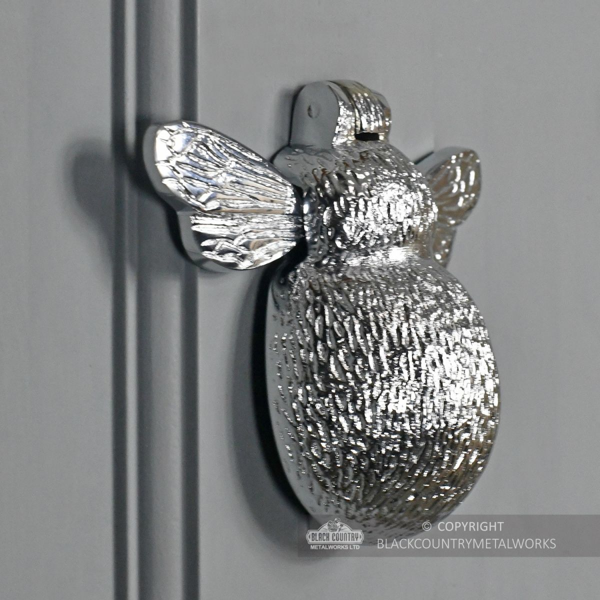 Side View of the Bright Chrome Bee Door Knocker