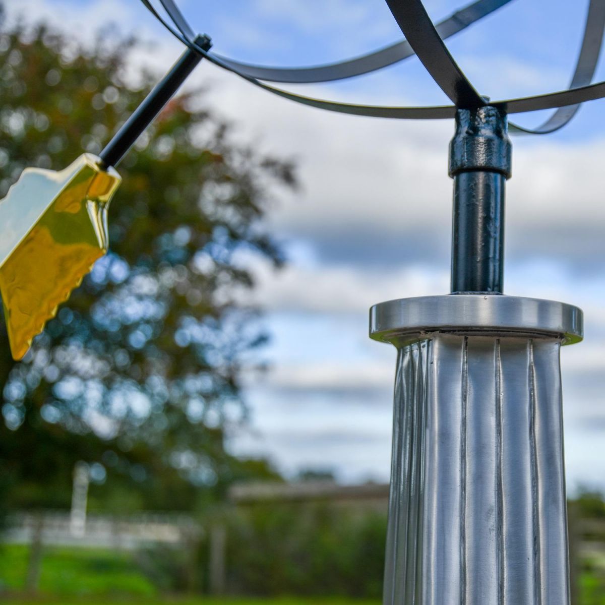Close up of globe, arrow and integrated plinth Close up of globe, arrow and integrated plinth