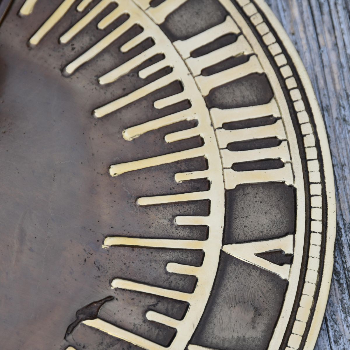 Close up of roman numerals on sundial 