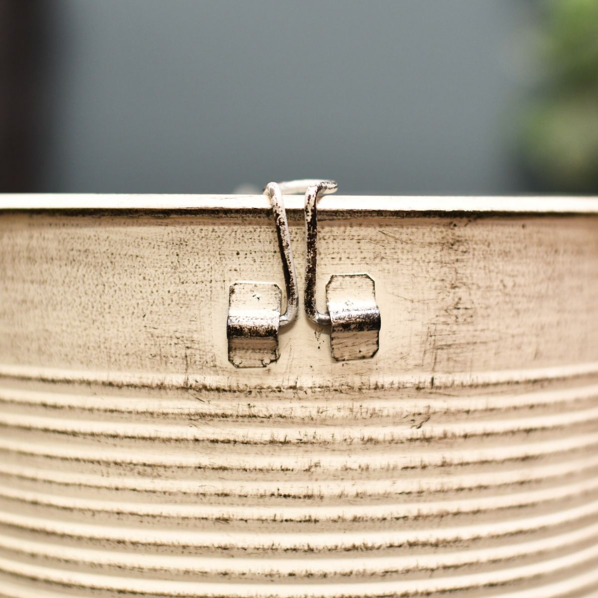 Clasp on fireplace fuel container