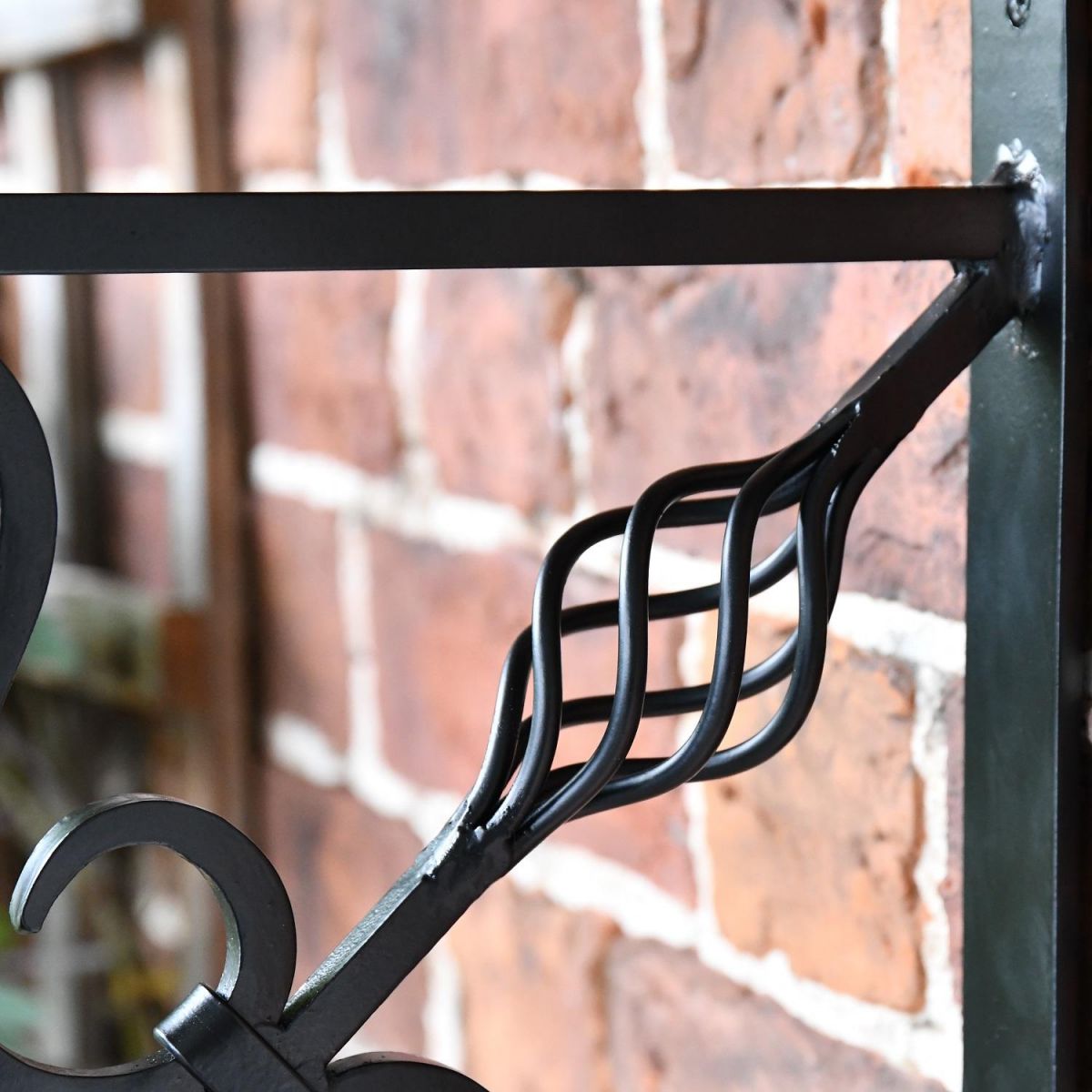 Close up of twisted basket on bracket Close up of twisted basket on bracket