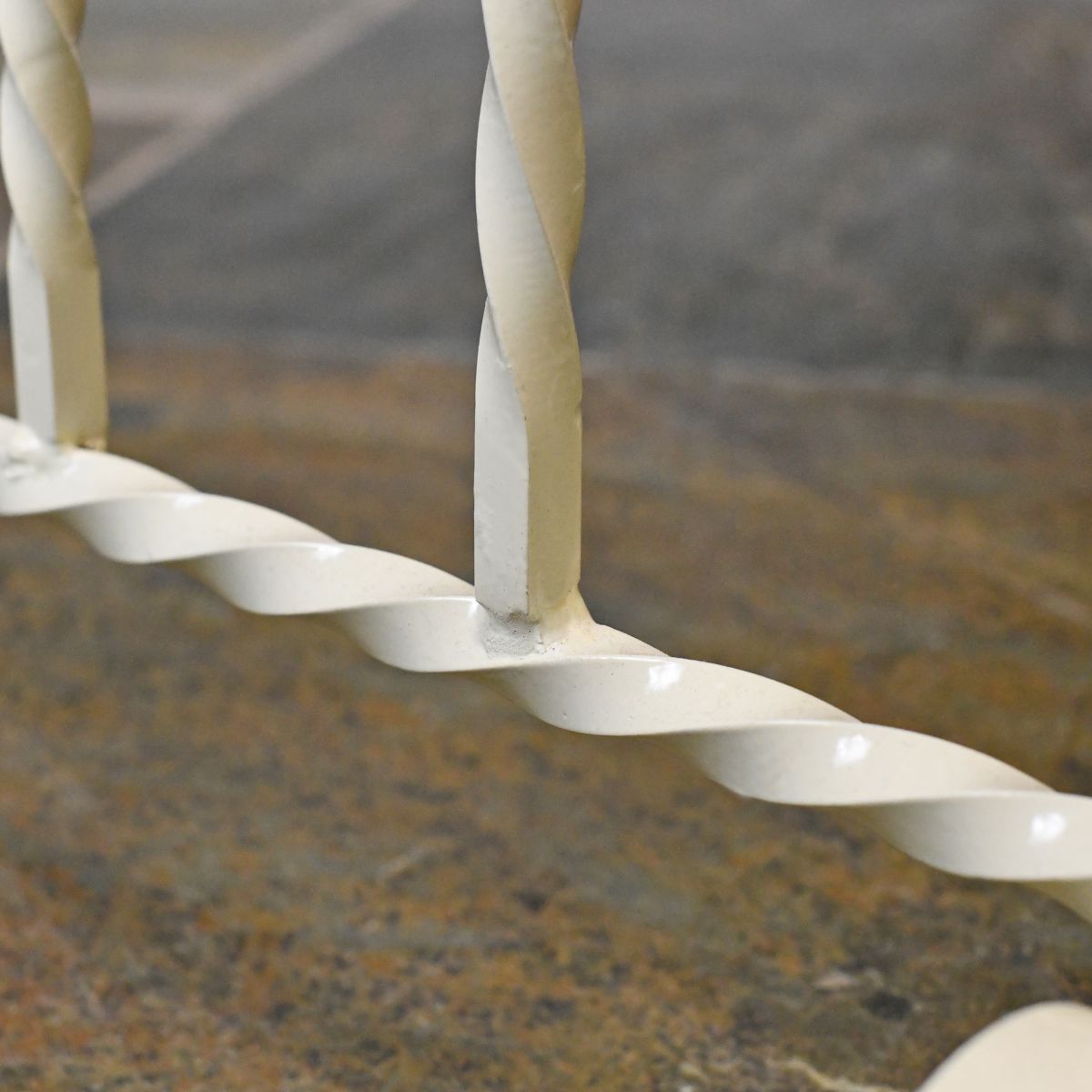 Close up image of blacksmith twist frame work on boot rack