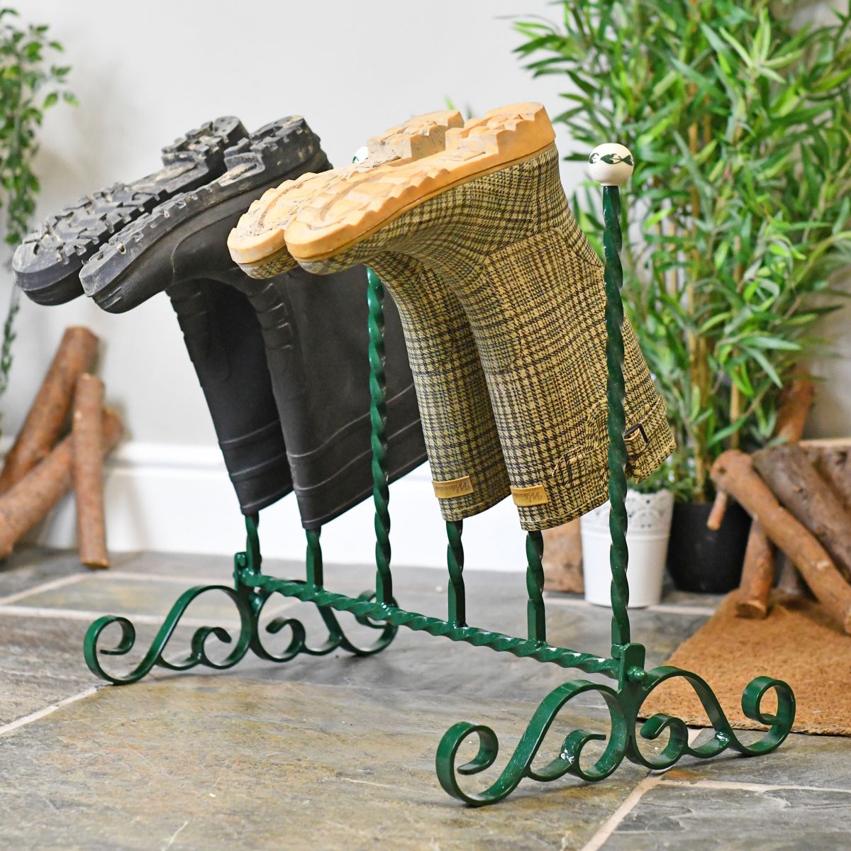 Green wrought iron welly rack 