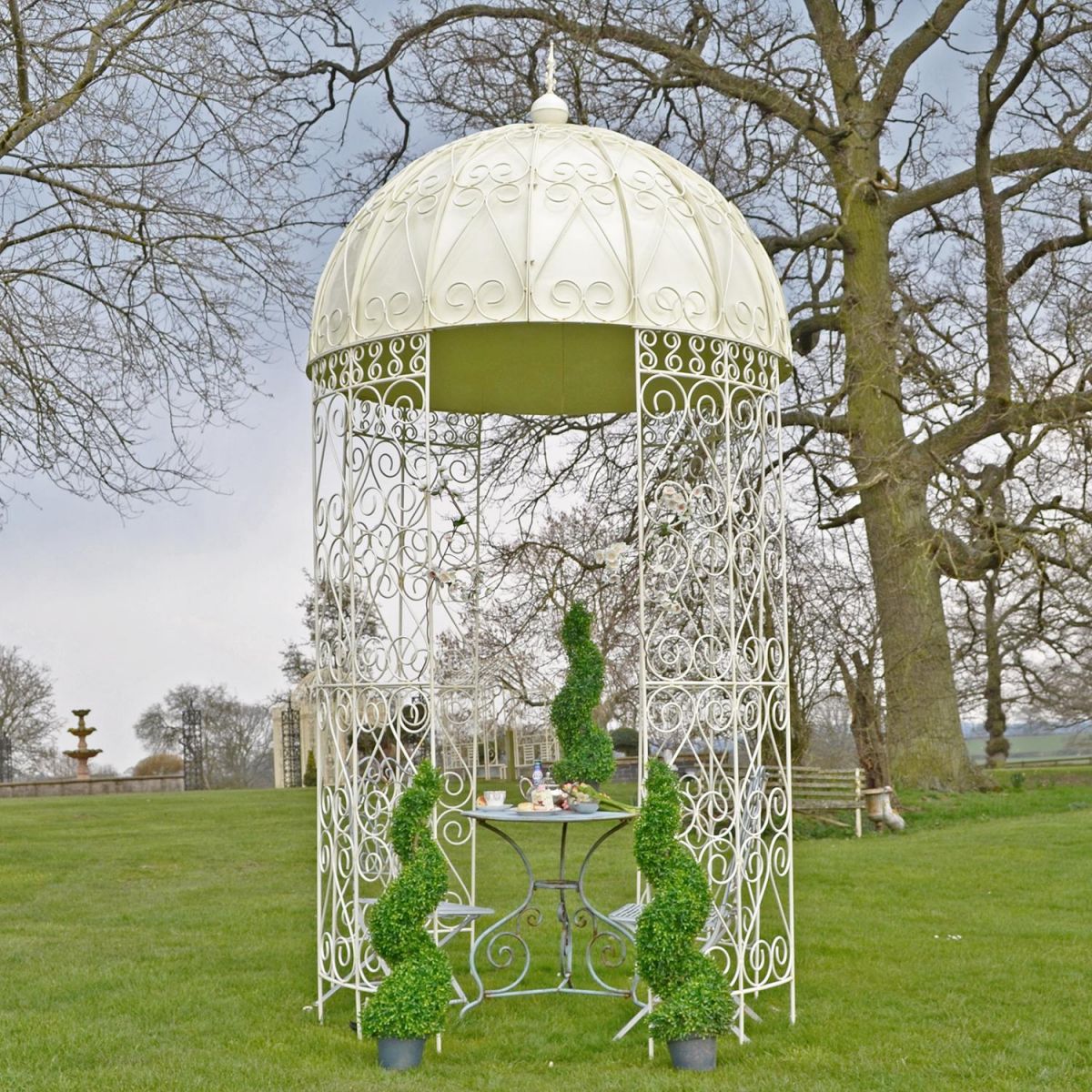 Ornate ironwork gazebo in garden