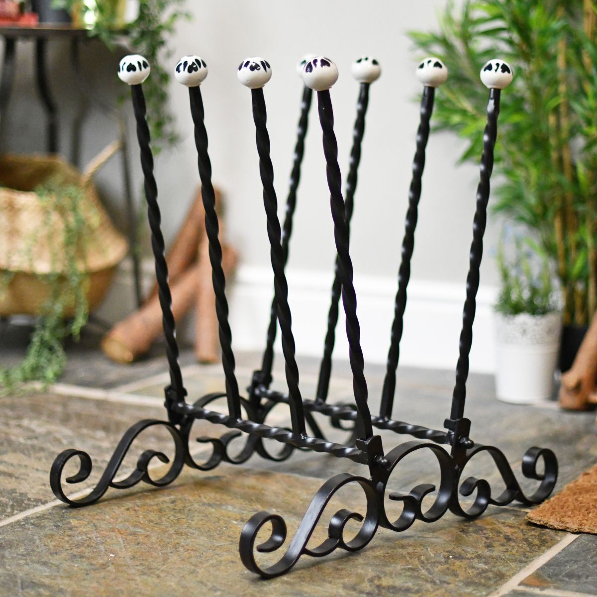 Black wrought iron welly boot rack ornate design Black wrought iron welly boot rack ornate design