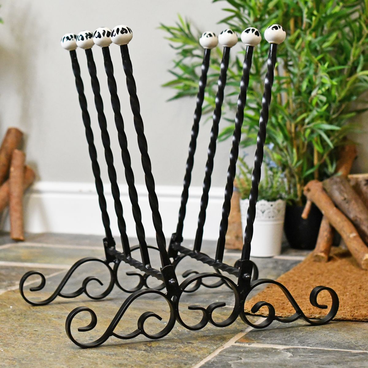 Side view of hand crafted twist and scroll boot rack Side view of hand crafted twist and scroll boot rack