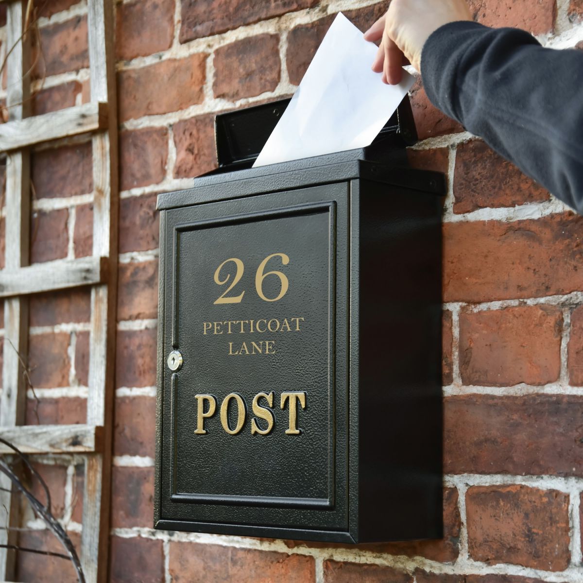 In situ photo of personalised traditional black post box In situ photo of personalised traditional black post box