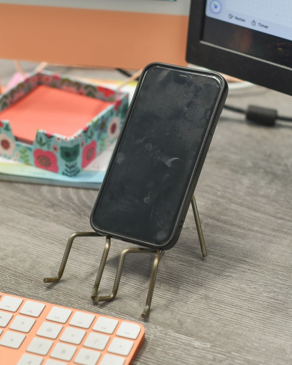 In situ photo of Recycled Metal "Hand in Hand" Phone Stand