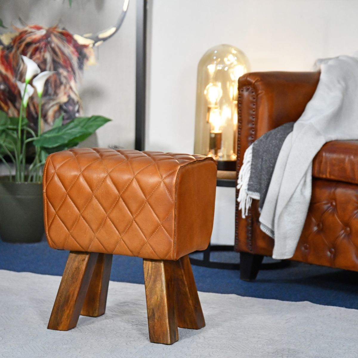 In situ photo of diamond stitched tan leather foot stool