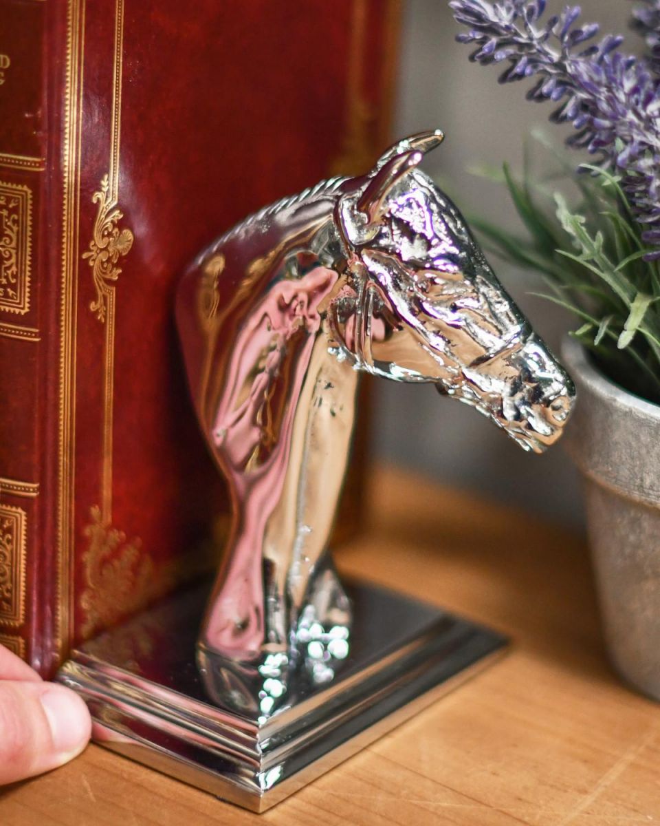 Scale Shot of Individual Bright Chrome Horse Head Bookend