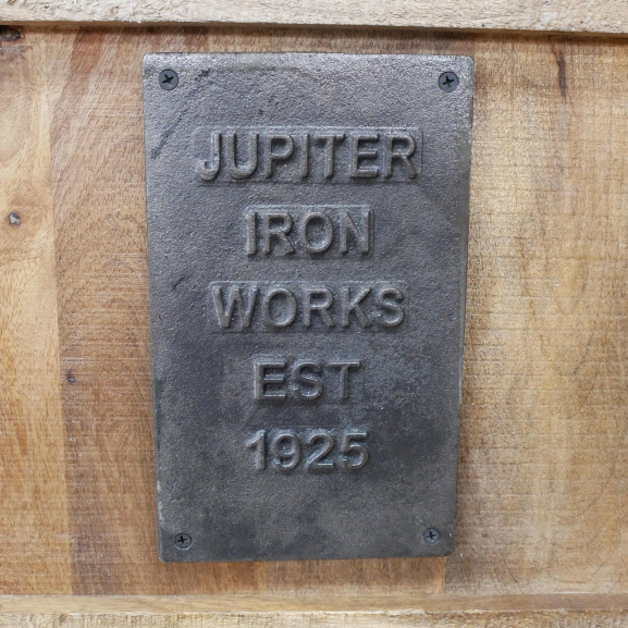 Industrial "Jupiter Iron Works" Plaque on the TV Cabinet