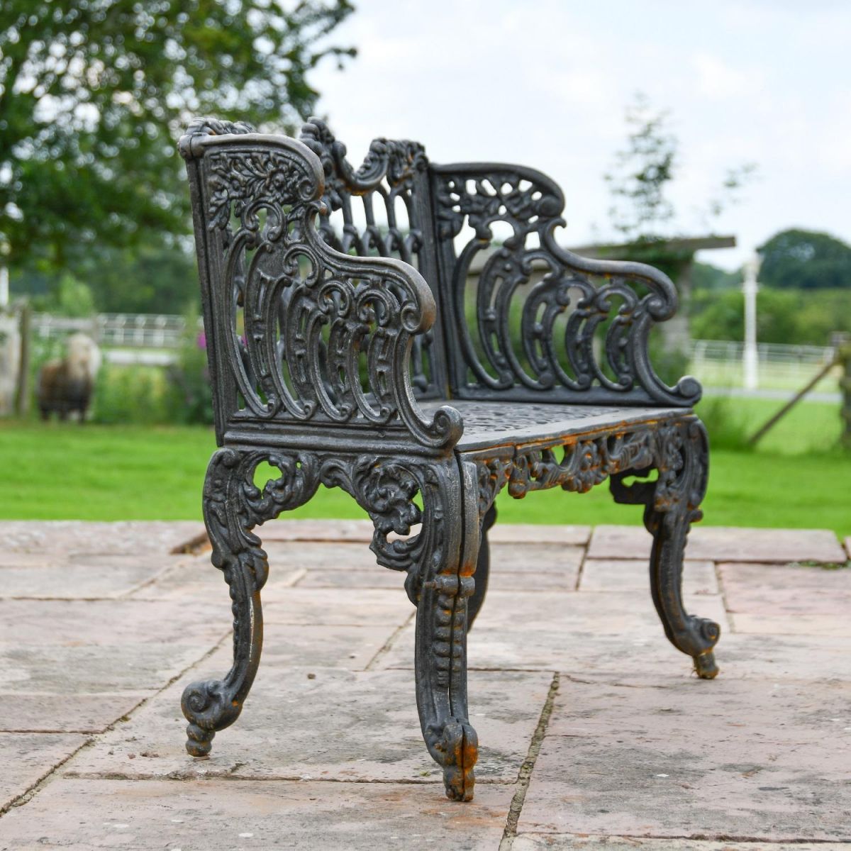 Side view of Cast Iron Ornate Aged Black Garden Bench  Side view of Cast Iron Ornate Aged Black Garden Bench