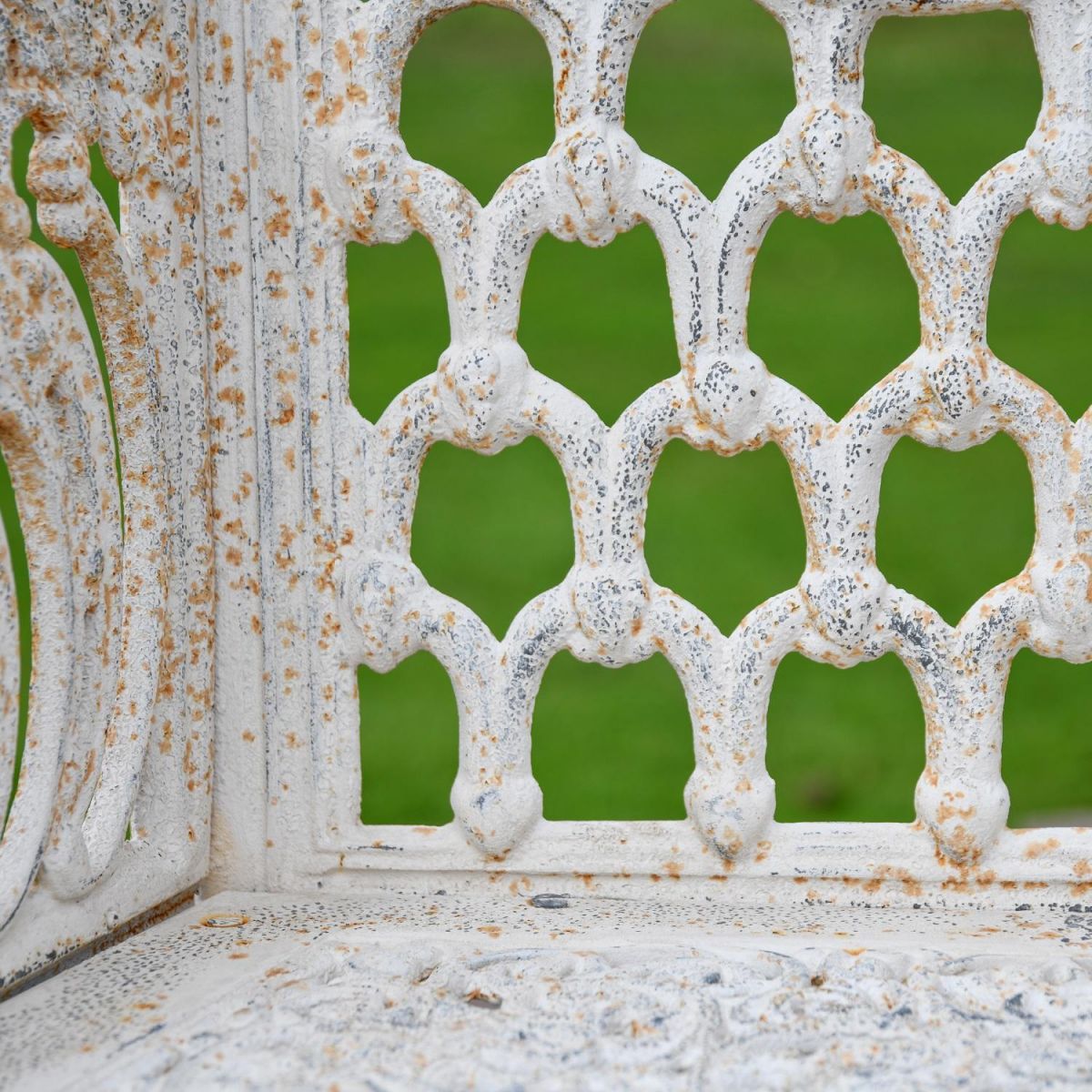 Close up of Cast Iron Garden Bench Details with Antique Cream Finish Close up of Cast Iron Garden Bench Details with Antique Cream Finish
