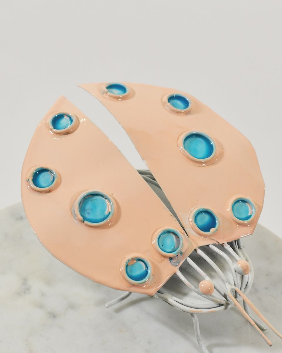 Close up of wing detail on scrap metal art sculpture Close up of wing detail on scrap metal art sculpture