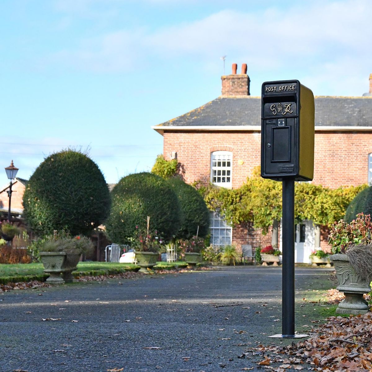 King George Rex Black Period Post Box on a Column in Situ in the Front of a House