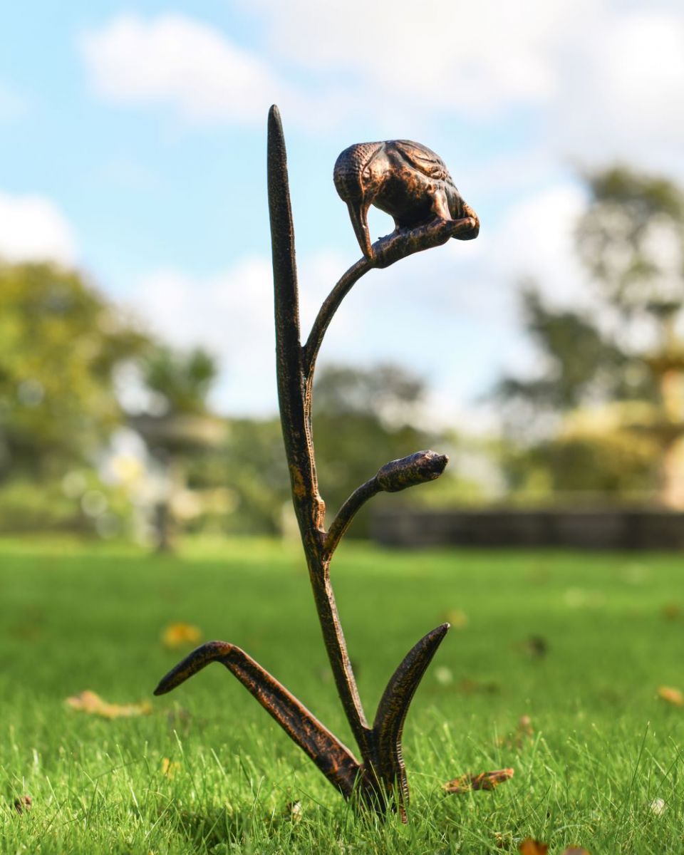 Full view of kingfisher on reed sculpture