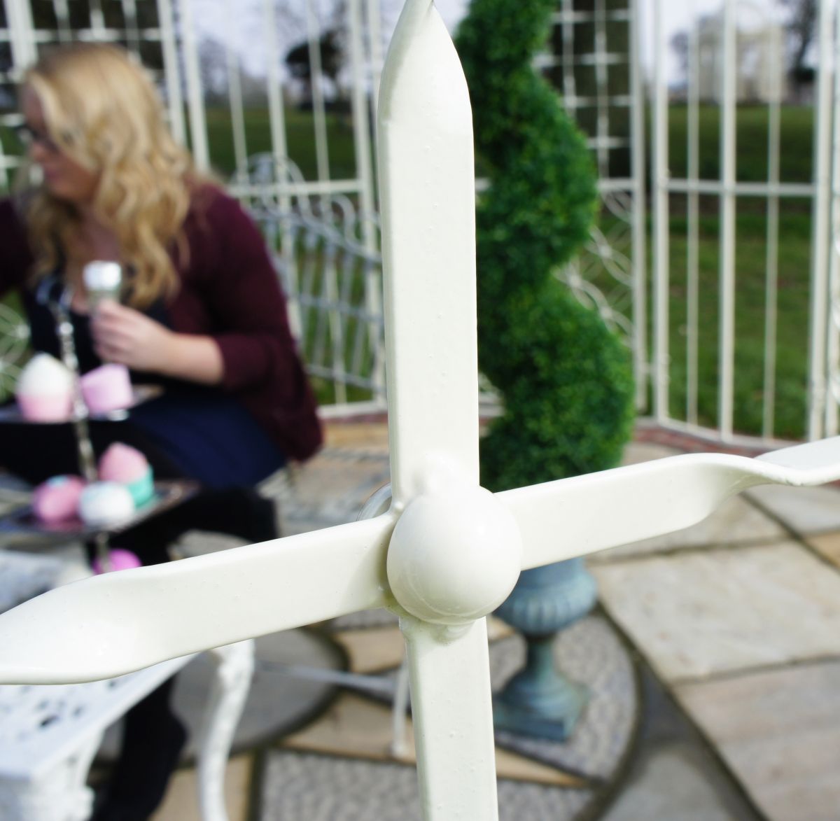Close up of wrought iron detailing on metal garden gazebo