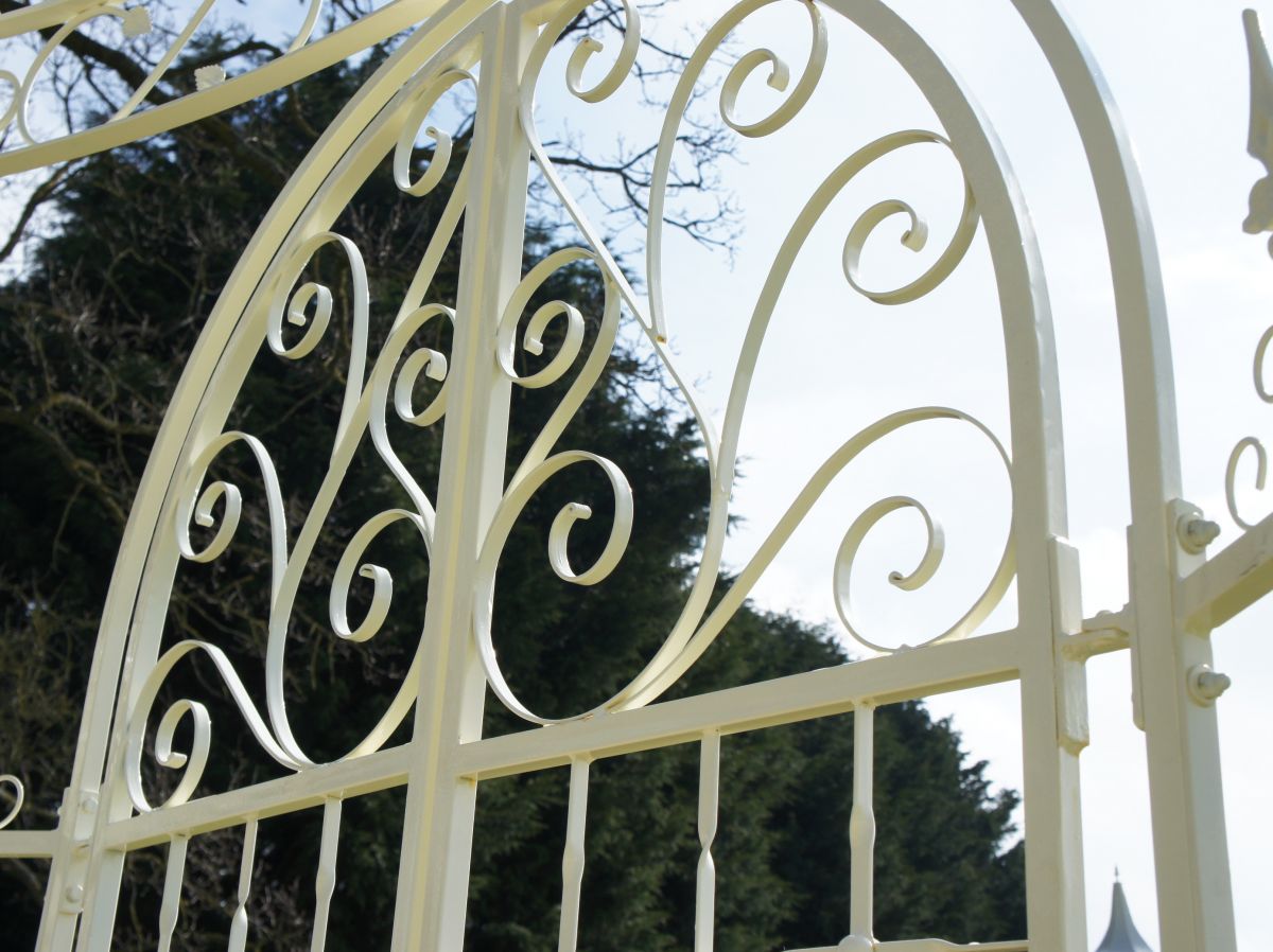 Close up of intricate scrollwork on iron outdoor pavilion