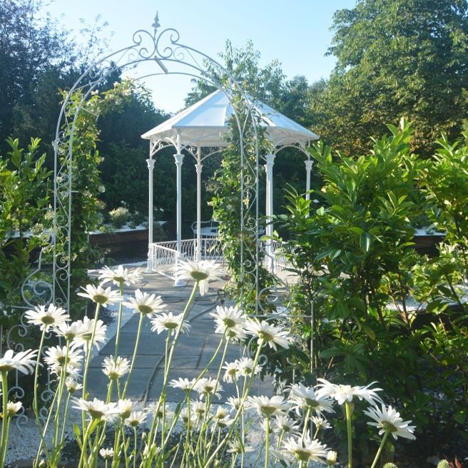 Cream "Lady Madeline" gazebo in situ in a beautiful garden