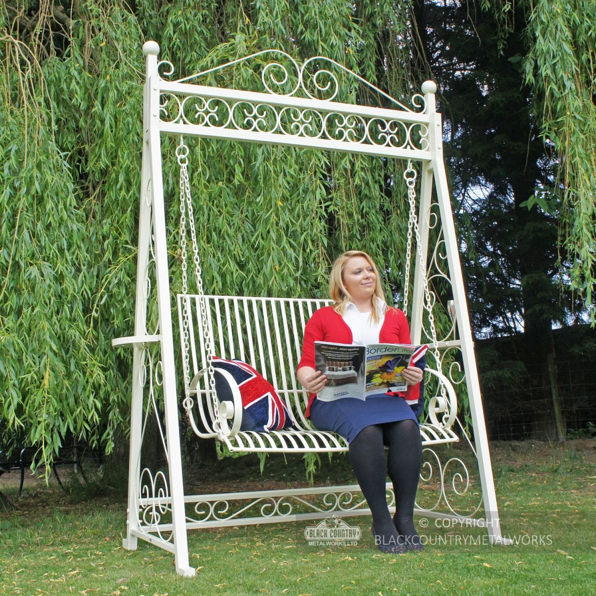 Lady sitting on garden swing seat